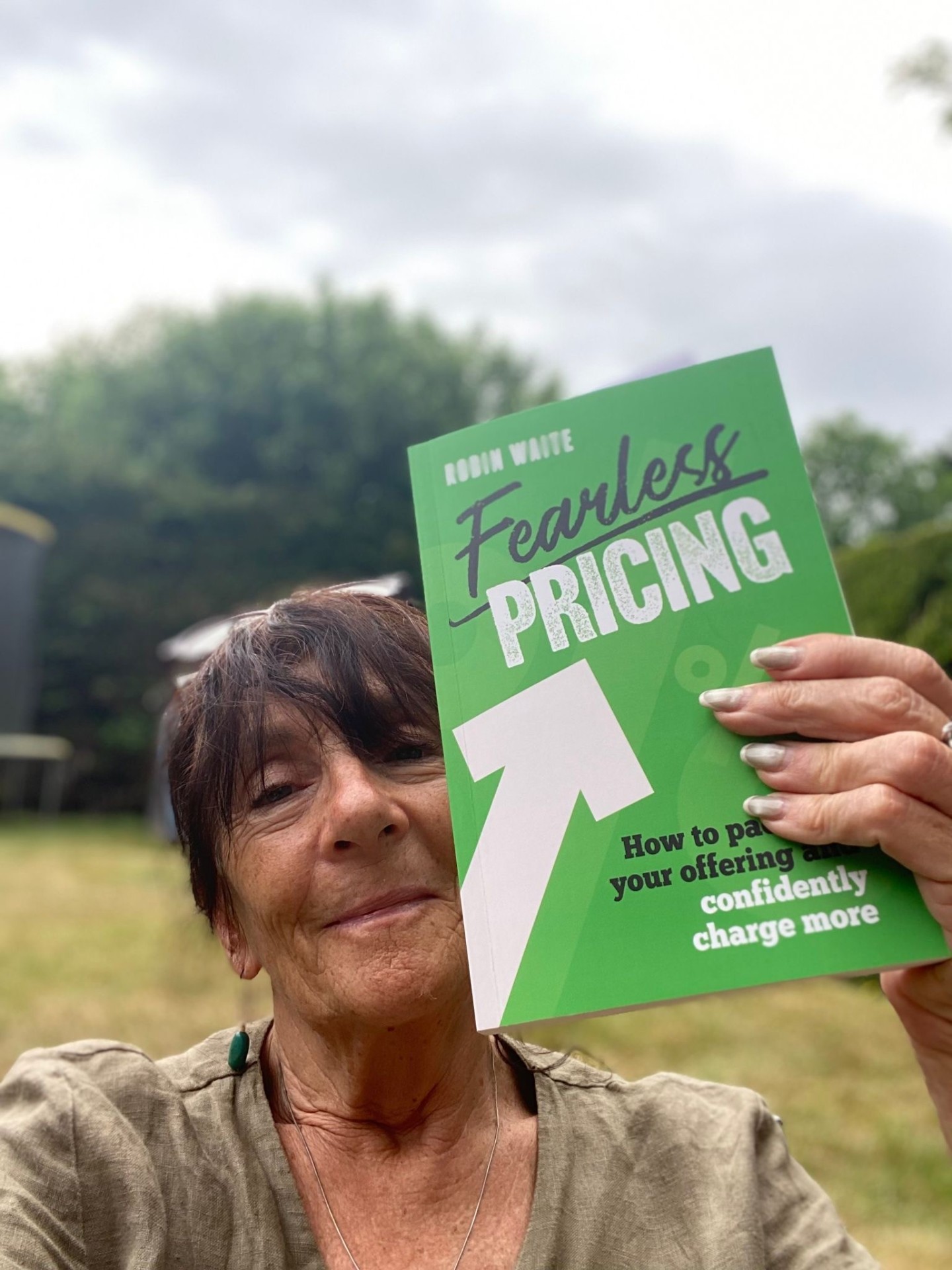 Jojo holding Fearless Pricing by Robin Waite