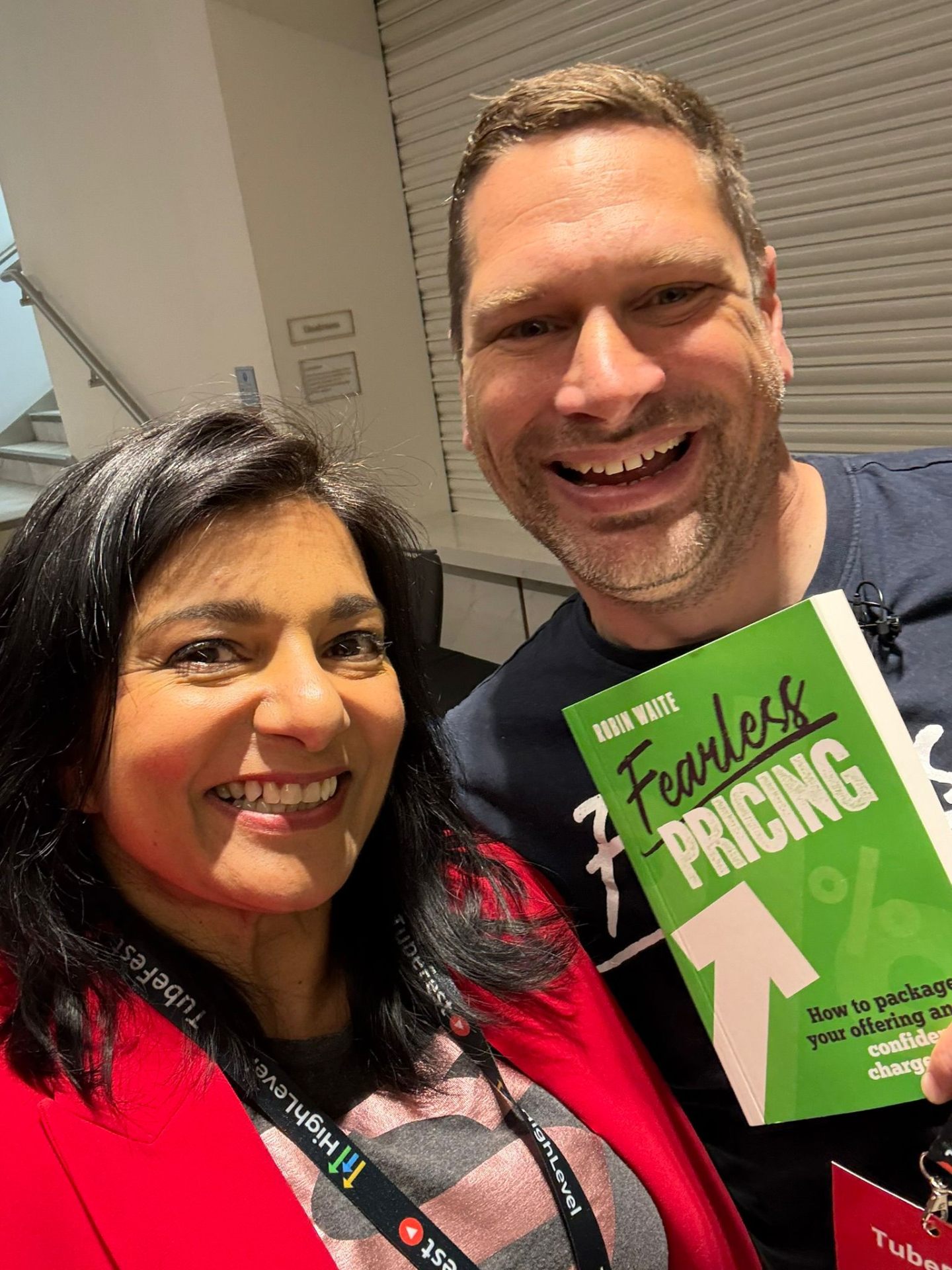 Sapna Pieroux holding Fearless Pricing by Robin Waite